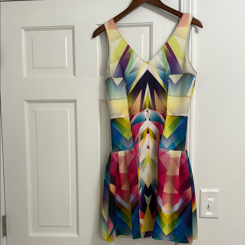 Nicole Miller mini multi color dress with cut out back and zipper. Size 6